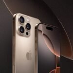 iPhone confiável modelo Pro em acabamento dourado com câmera tripla, exibido com tela ligada em fundo escuro sofisticado.